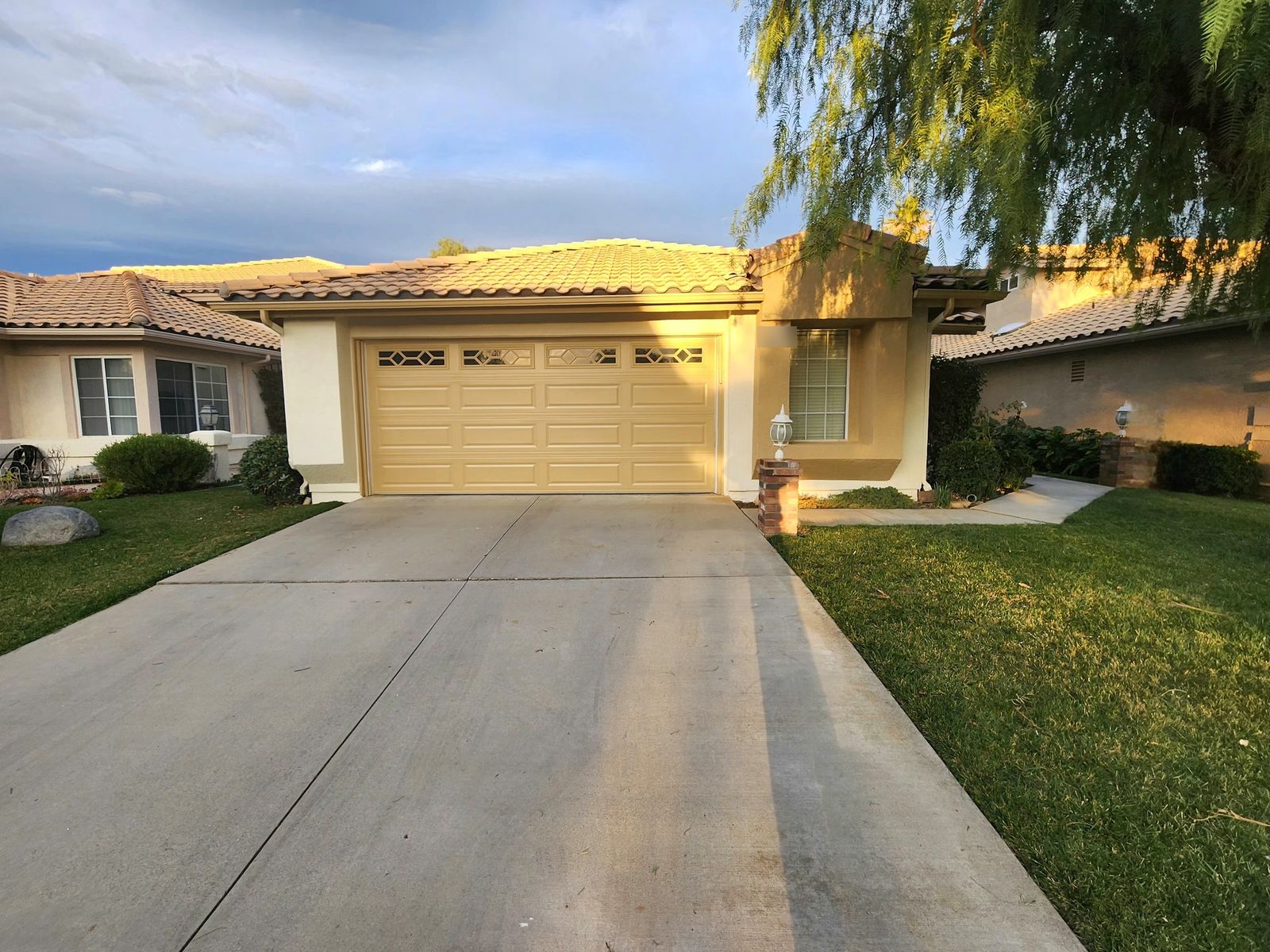 After: exterior repainted in a warm neutral with crisp trim